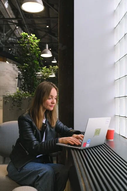 A contemporary workspace showcasing a laptop, tablet, and smartphones, ideal for tech and freelance use.