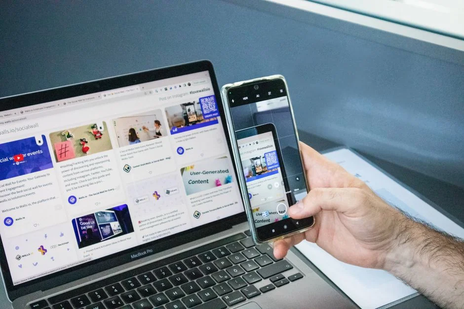 A sleek office desk setup featuring Apple devices: iMac, MacBook, and iPad.